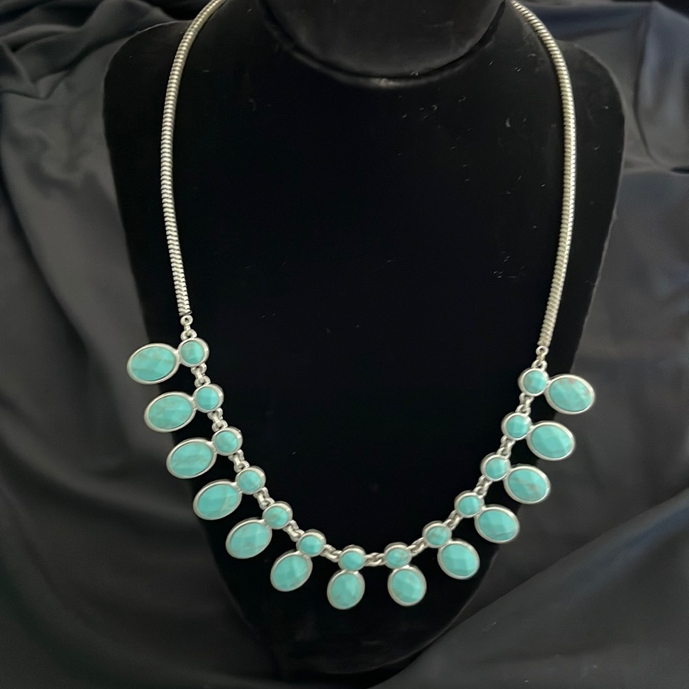 Necklace with turquoise colored charms